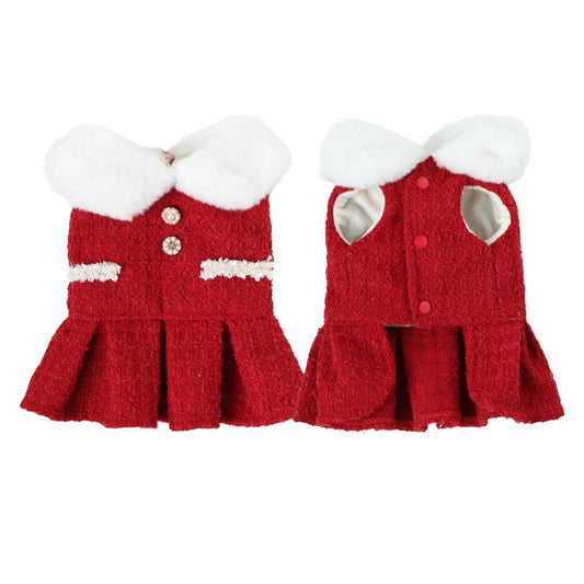 Red knitted dog dress with white trim on a white background